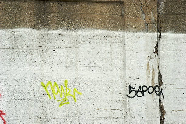 istock Gang Tags on Crumbling White Concrete Wall 172177369
