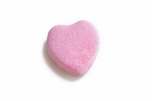 Isolated photo of a blank pink candy heart - perfect for inserting custom message.