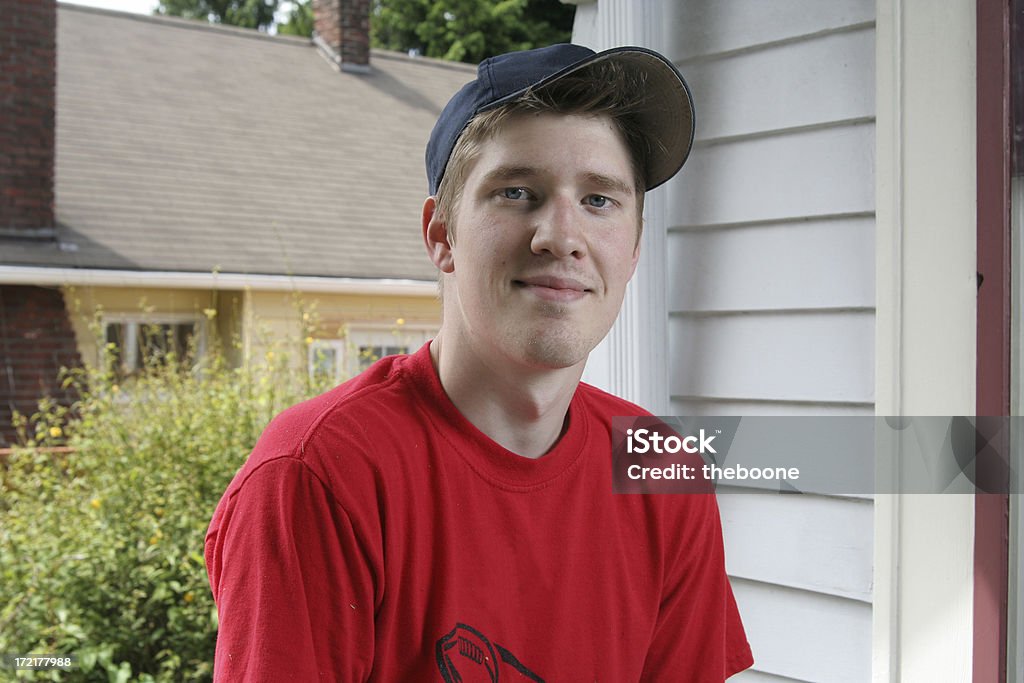 young man young guy on a front porch Porch Stock Photo