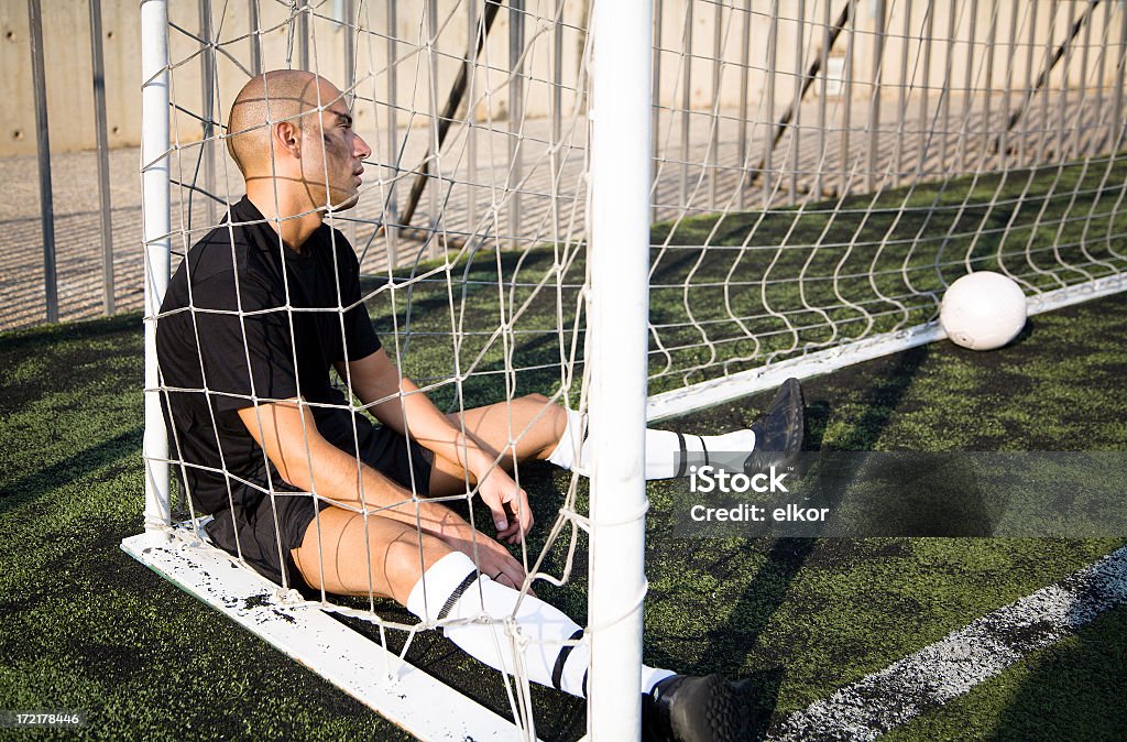 Lost game Frustrated soccer goalkeeper. Soccer Stock Photo