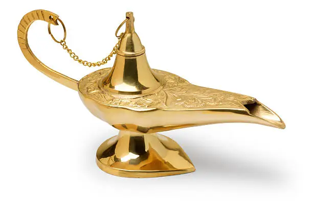 A gold genie lamp on white background with a soft shadow.