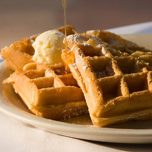 belgian waffles with butter and syrup - stroopwafel stockfoto's en -beelden