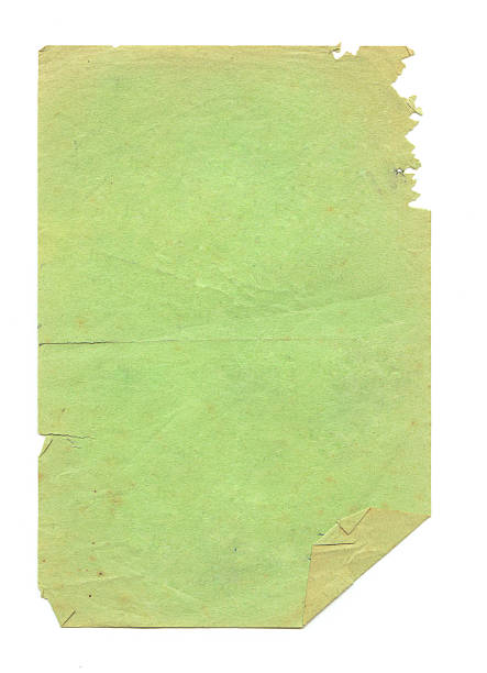 Green Grungy Paper Sheet of paper that's been nibbled on by something (I'm not going to even ask).  The corner is folded over and there are small creases and stains on the paper. chewed stock pictures, royalty-free photos & images