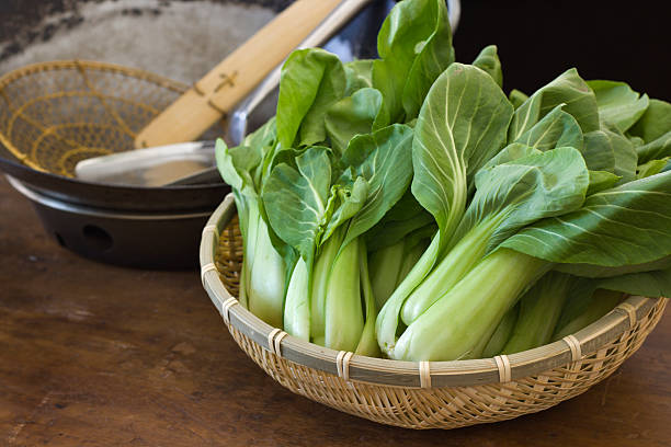 Cooking and Preparing Chinese Bok Choy Vegetable in Kitchen stock photo