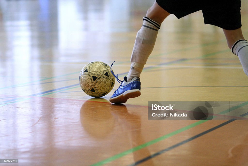 soccer indoor soccer players dribbling the ball indoor Indoors Stock Photo