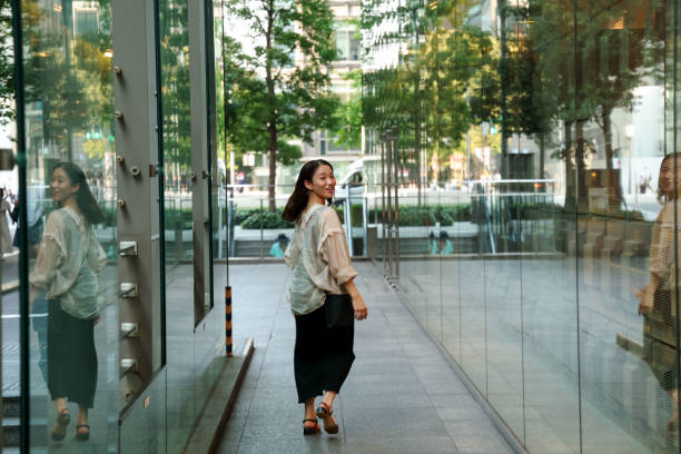 istock Young beautiful woman walking at shoping street 1721799528