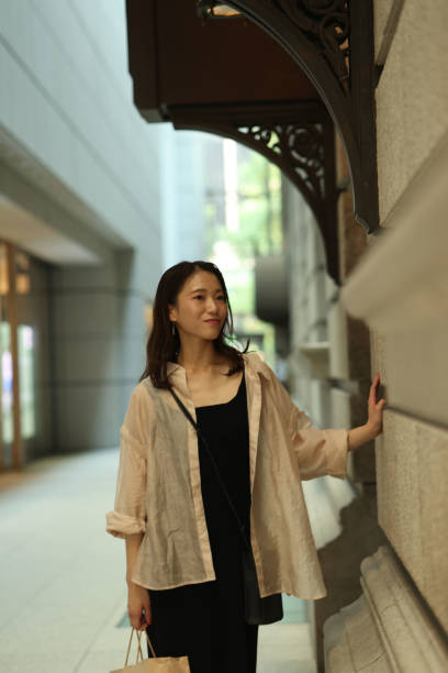 istock Young beautiful woman walking at shoping street 1721799545