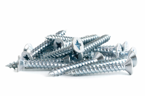 A pile of countersunk zinc-plated screws.
