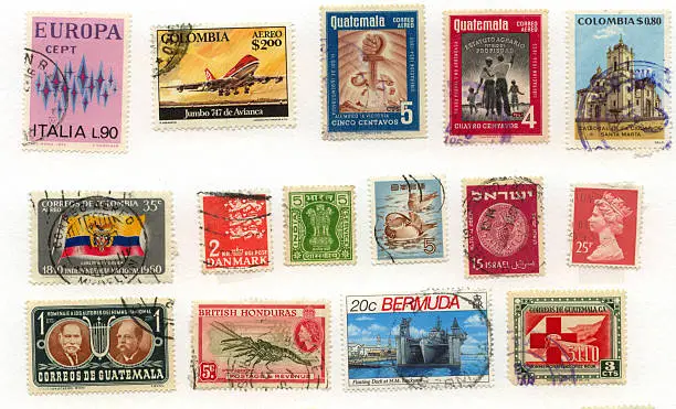 "A collection of vintage international postage stamps, used, with postmarks."