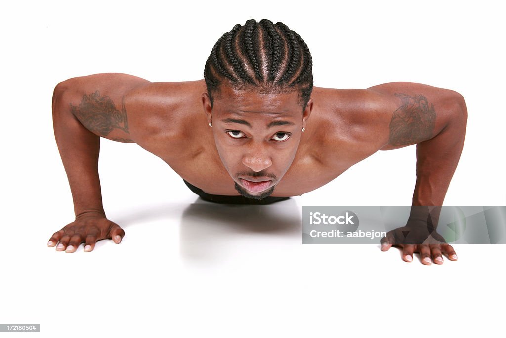 Push Ups Young man doing push ups. Please view all pictures of this Cornrow Braids Stock Photo