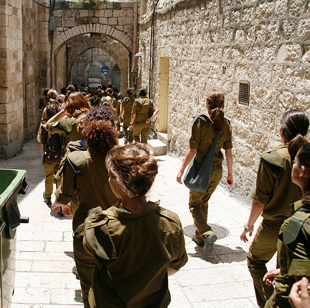 Army cadet class marches through Old City in Jerusalem after graduation ceremony.