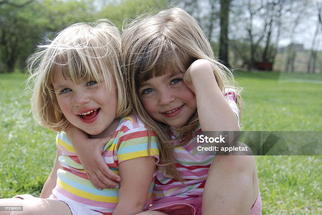 Sisters in the Spring Sisters hanging out together and playing in the spring time 2-3 Years Stock Photo