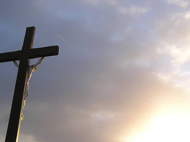 istock Christ on Cross During a Cold Snowy Morning Sunrise 172181084
