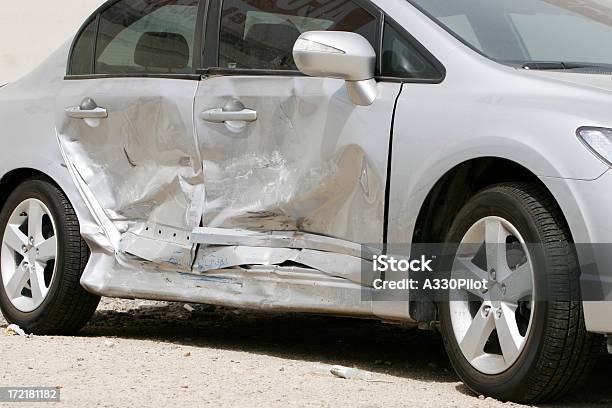 Silver Car With A Large Dent In The Side Ruining Two Doors Stock Photo - Download Image Now