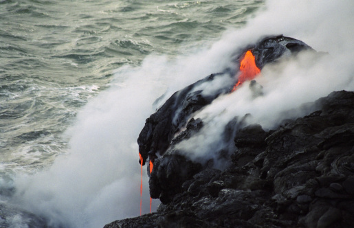 A lava flow from Kilauea on the Big Island of Hawaii streams into the sea.