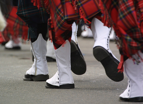 Detail of spats worn on the feet of an Irish marching band while performing in a St. Patrick's Day parade.