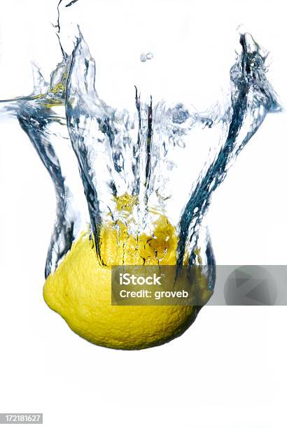 Lemon Dropped Into Water Stock Photo - Download Image Now - Bubble, Citrus Fruit, Clean