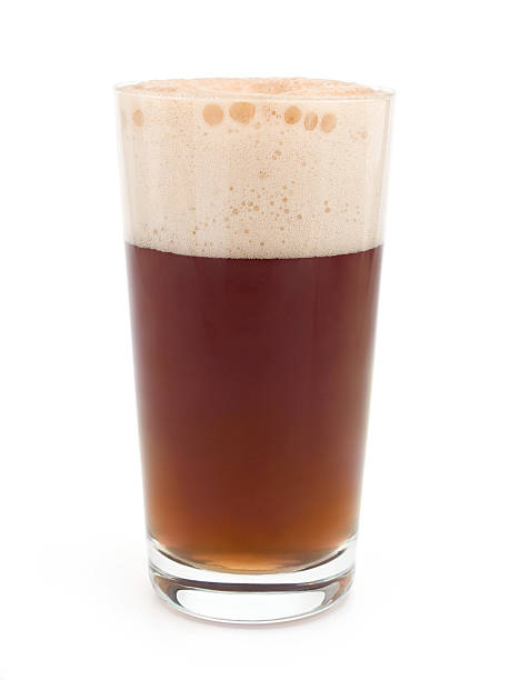 Dark beer Glass of dark beer with rich foam froth beer bubble quencher stock pictures, royalty-free photos & images