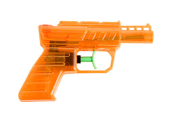 pomarańczowy woda gun 3 - toy gun zdjęcia i obrazy z banku zdjęć