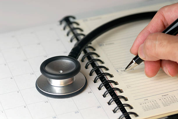 Stethoscope and diary for next appointment stock photo