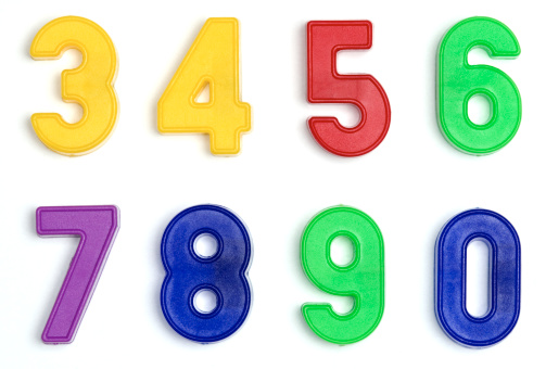 Multicolored plastic letters A, B and C isolated on white background