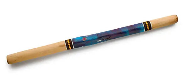 An Australian didgeridoo on white with soft shadow