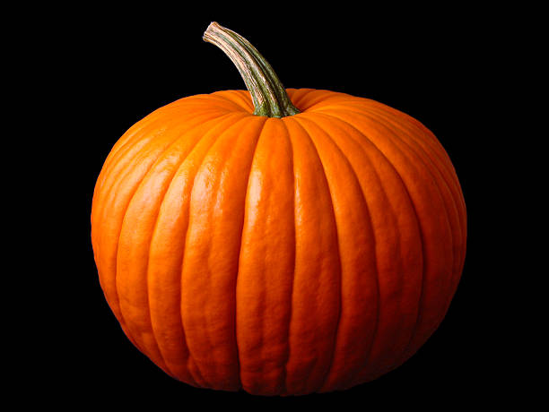 Close up of a large Halloween pumpkin Big halloween pumpkin on black halloween pumpkin jack o lantern horror stock pictures, royalty-free photos & images