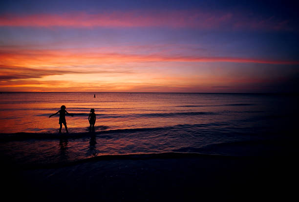 istock kids in the surf 172182933