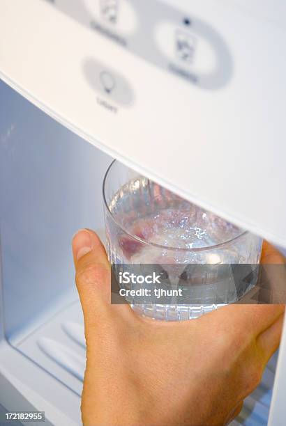 Refreshing Water From Fridge Stock Photo - Download Image Now - Water Cooler, Refrigerator, Appliance