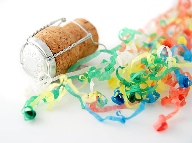 istock celebration with party streamers and champagne cork 172183138