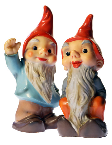 Two garden gnomes. This pair of antique gnomes are on 100% white background. See also similar gnomes with a totally different attitude in shot #1898159.