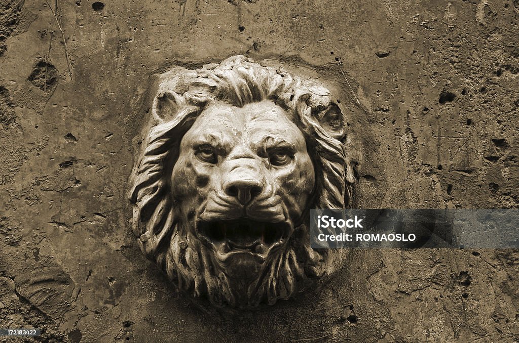 Spooky lion head decoration on a Roman wall, Rome Italy "Spooky lion head decoration on a Roman wall, Rome Italy-OTHER Roman walls:" Abstract Stock Photo