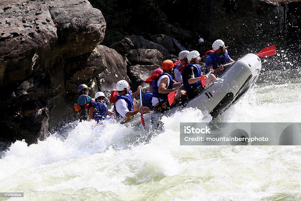 White Water Adventure Rafters having a good run as they pass through a class five. Vacations Stock Photo