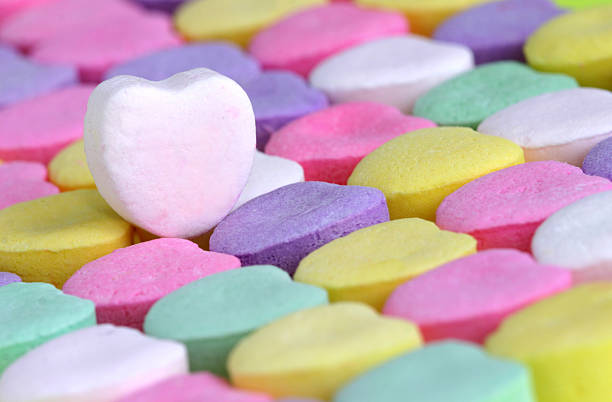 istock Rows of candy hearts with a white heart on top 172184060