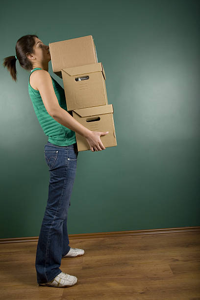 moving house - solitude loneliness hardwood floor box stock-fotos und bilder