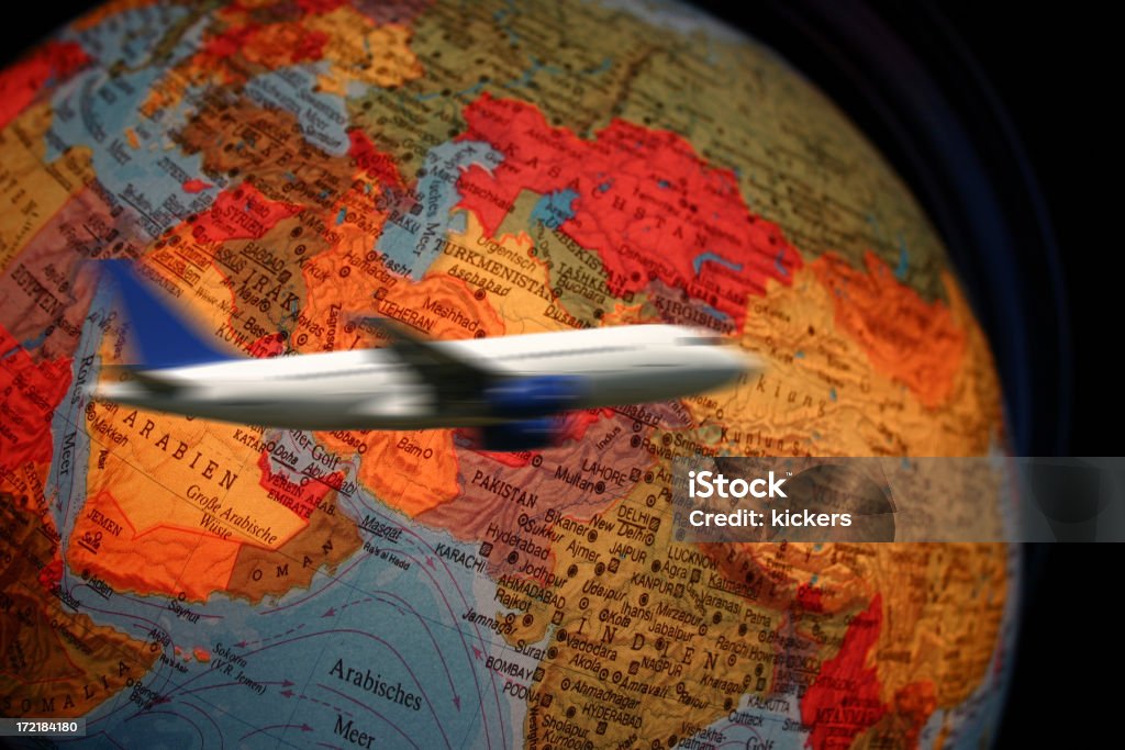 Airliner flying around globe An airplane flying around the globe Airplane Stock Photo
