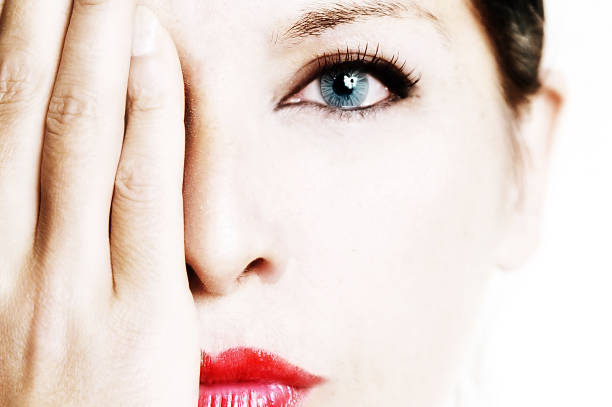 Elegant high-key portrait of a woman, creating a bright and ethereal visual effect.