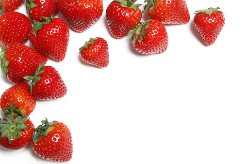 close up of some fresh strawberries, on a white background