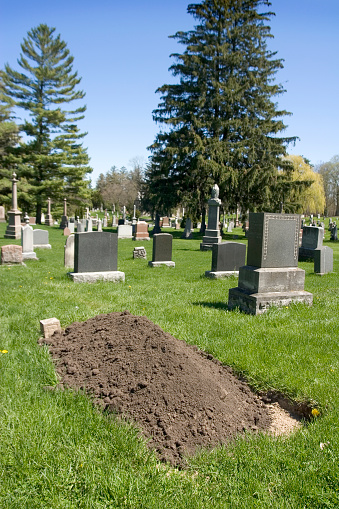 Dirt piled at cemetary plot.