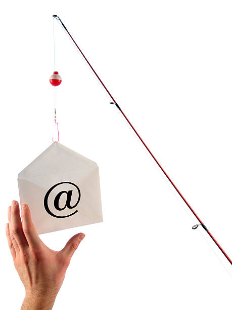 Phishing Concept: Fishing Pole Dangles Email and Hand Takes Bait This color photo shows a phishing concept. A red fishing pole with a bobber dangles a white envelope with the @ symbol at the end of a hook while a hand reaches up to take the bait. The envelope with the @ symbol represents email. Image is isolated on white background in portrait orientation. fishing rod photos stock pictures, royalty-free photos & images