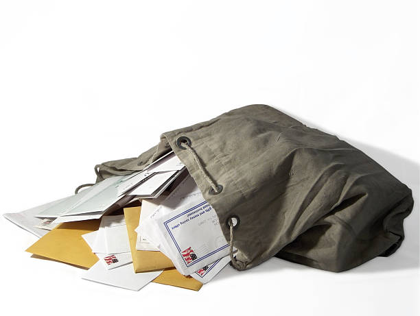 Sack of Mail Dirty canvas postal sack overflowing with mail sack photos stock pictures, royalty-free photos & images