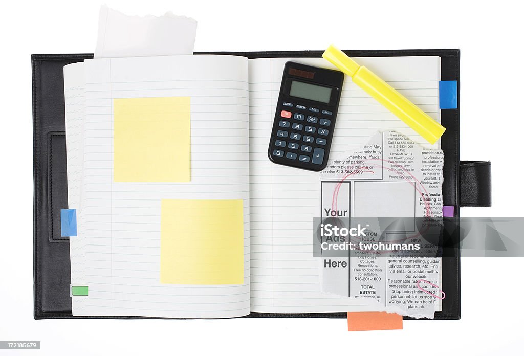 Insert your ads "Opened book with blank post-it, a calculator, a yellow marker and an ads part of a newspaper. Note that the content of the ads paper was created by us." Highlighter Stock Photo