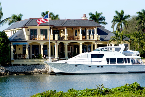 Yacht outside home on the water