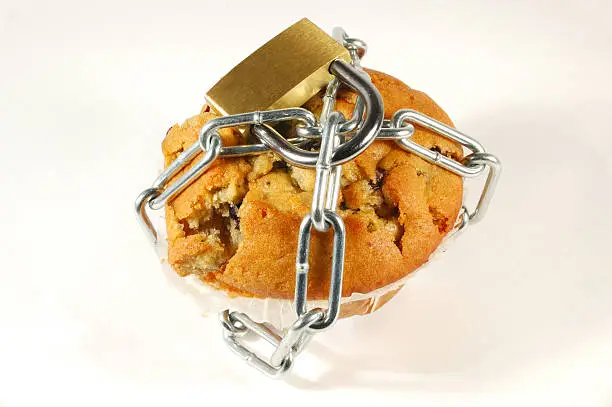 "Blueberry muffin chained and lock. Pro diet, anti fat or sugar theme."