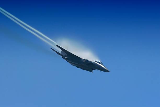 istock f-15 Jet fighter diving hard toward the deck 172186108