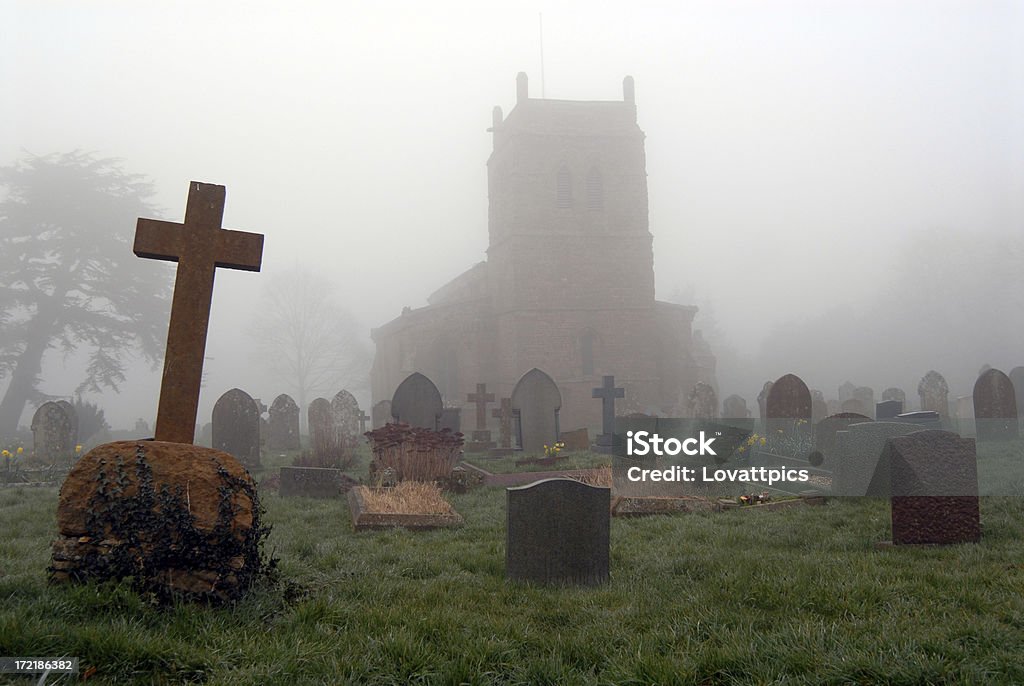 churchyard an atmospheric picture of an old churchyard. taken on a foggy morning. Ancient Stock Photo