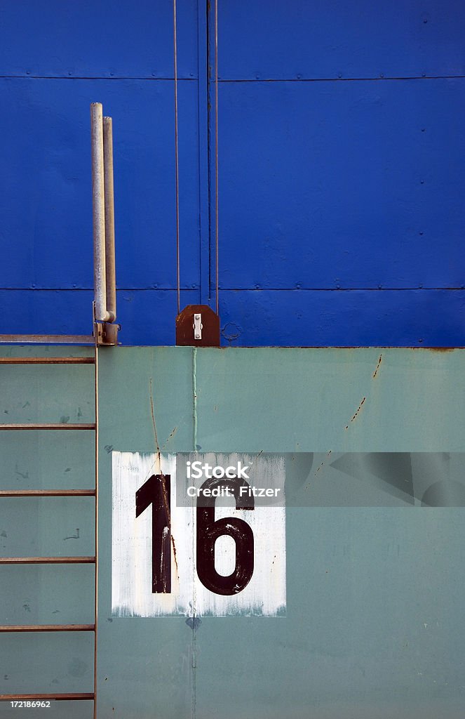 sixteen on white "blue industrial garage in a storage building with a green floodgate as a protection against high tide, harbor hamburg." Number Stock Photo