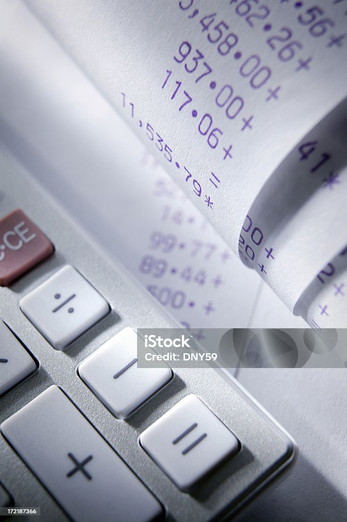 Accounting Calculating tape with calculator Balance Stock Photo