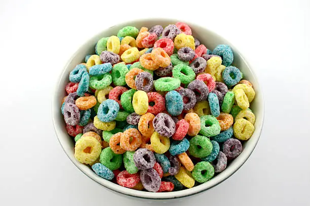 fruity cereal in a bowl. white background.