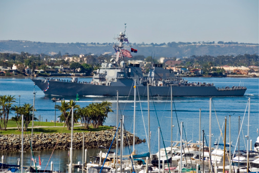 US Navy War Ship Entering San Diego Harbor after Duty in Iraq. Crew can be seen on deck.